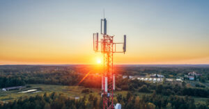 Cell tower with sunset