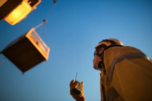 A construction worker using two way radios