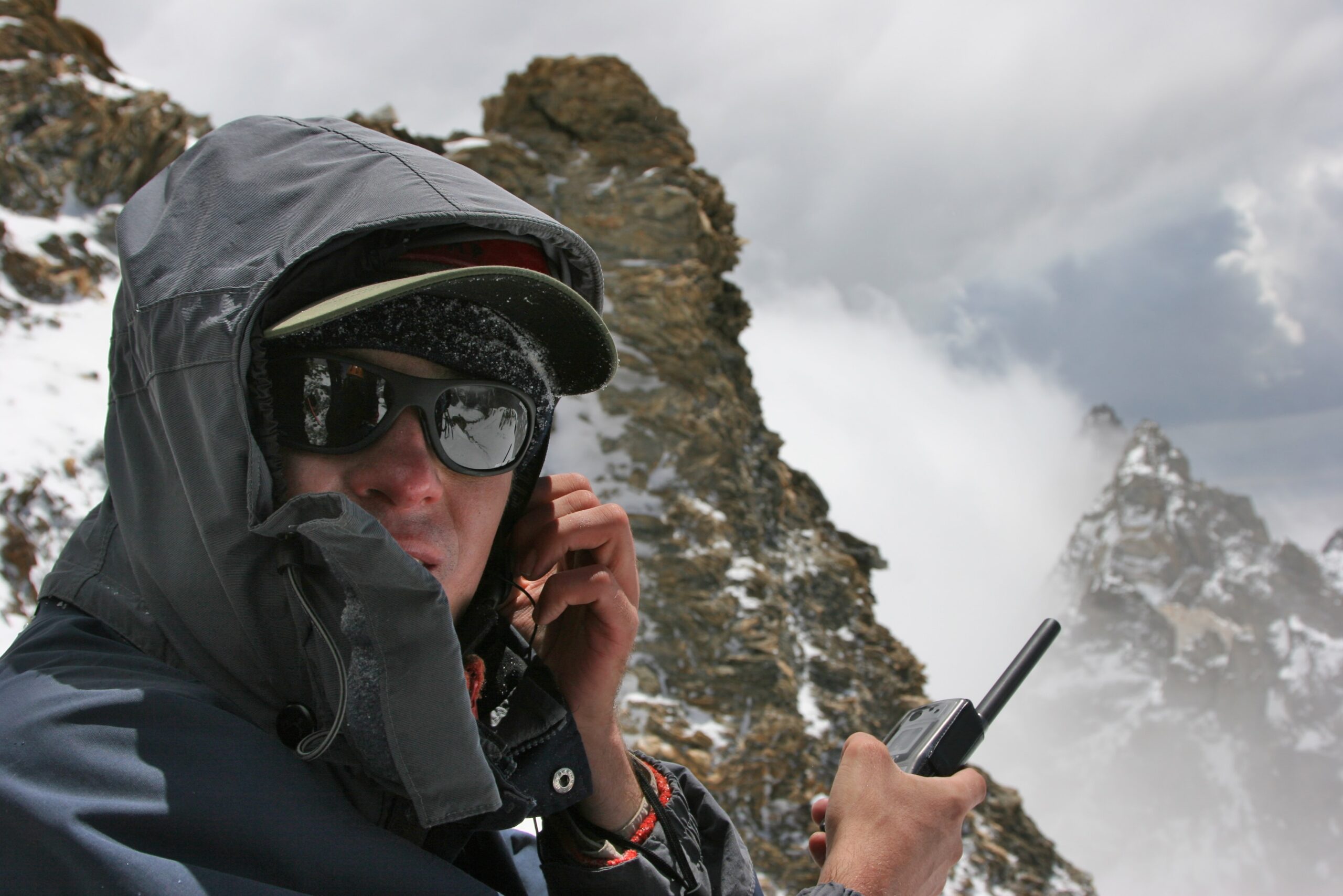 Man using a two way radios in a remote area