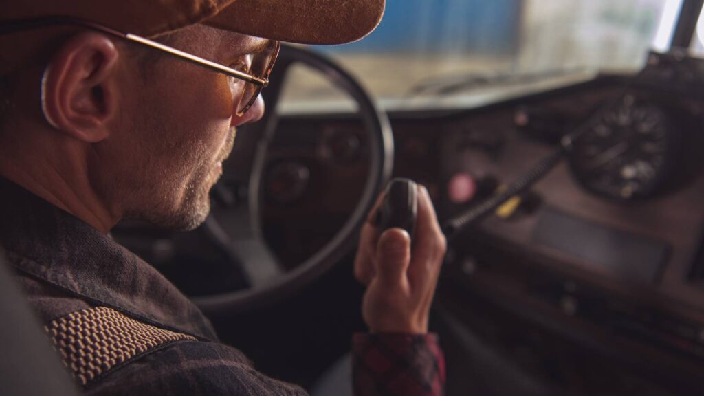 man talking on two way radios